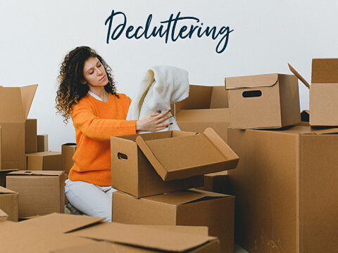 A woman decluttering the house